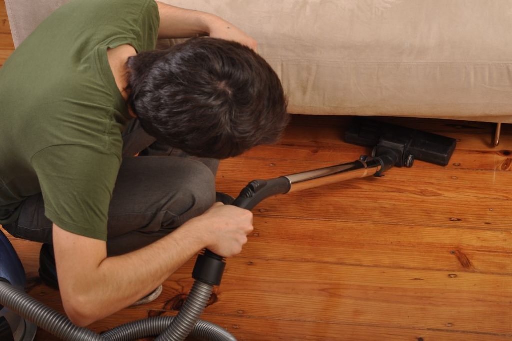 vacuuming under couch