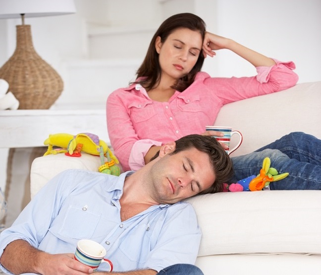 couple resting on couch
