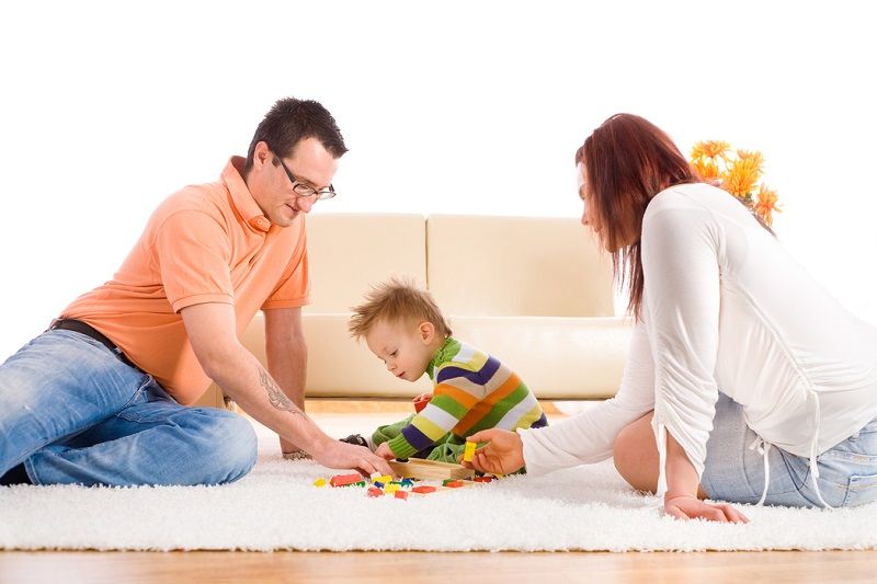 family on carpet with baby